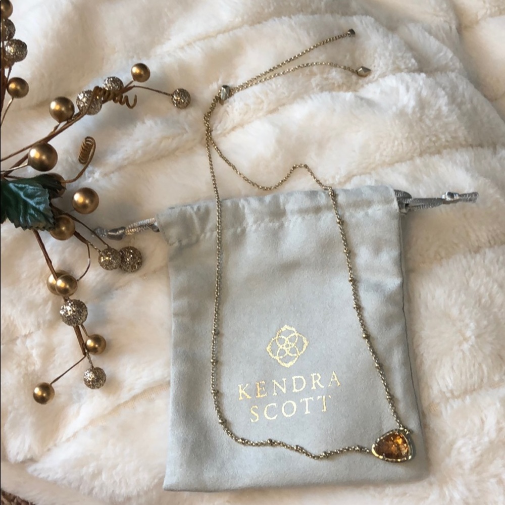 Kendra Scott gold necklace with copper pendant
